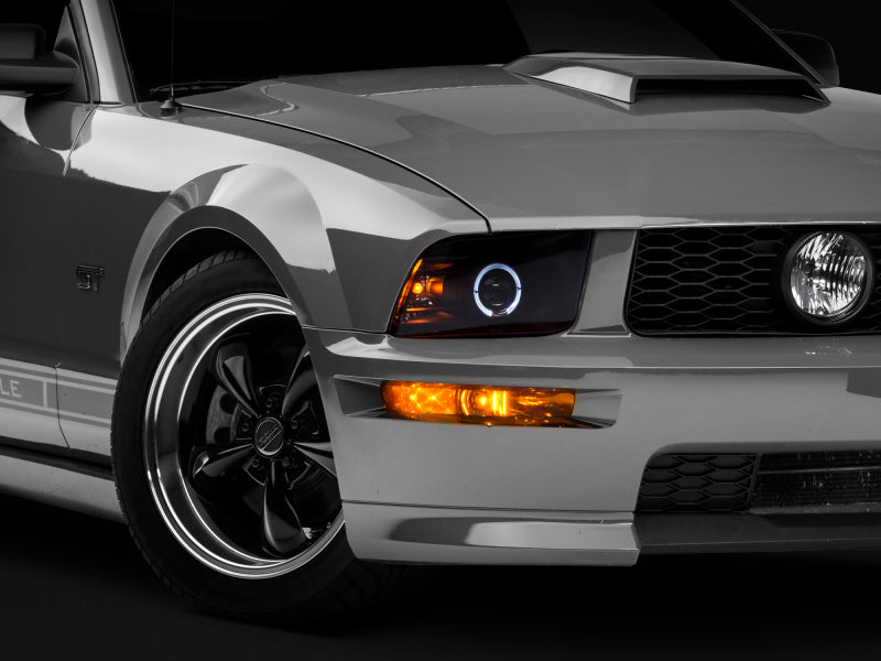 Raxiom 05-09 Ford Mustang Halogen 2010 Style LED Halo Headlights-Blk Hsng| Clear Lens/Excludes GT500