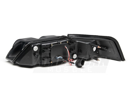 Raxiom 99-04 Ford Mustang Dual LED Halo Projector Headlights- Black Housing | Smoked Lens