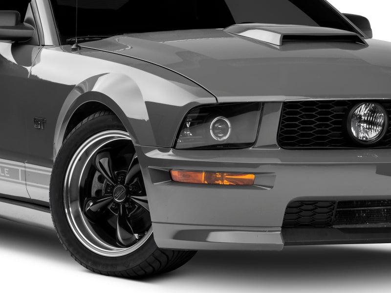 Raxiom 05-09 Ford Mustang Halogen 2010 Style LED Halo Headlights-Blk Hsng| Clear Lens/Excludes GT500