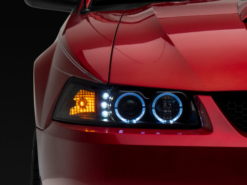 Raxiom 99-04 Ford Mustang Dual LED Halo Projector Headlights- Black Housing | Clear Lens