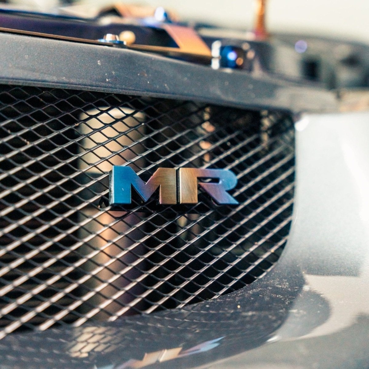 JDC Titanium "MR" Front Grill Badge (Evo 8/9) - JDMuscleBadgesJDC-TI-MR-MGRILLBurnt