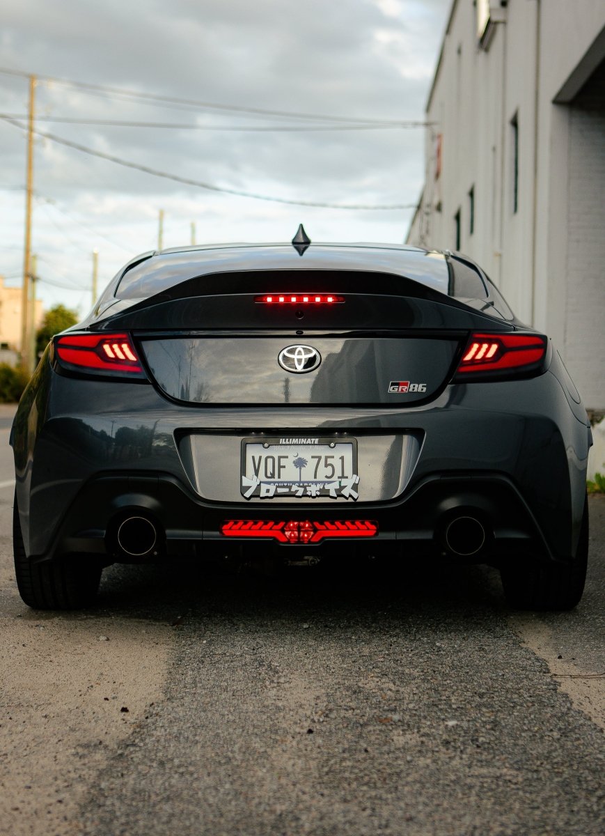 OLM V2 F1 Rear Fog Light (Clear Lens, Black Base, Red Bar) - 2022 BRZ / GR86 - JDMuscleOLME.49002.1-CBR