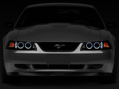 Raxiom 99 - 04 Ford Mustang Dual LED Halo Projector Headlights - Black Housing | Smoked Lens - JDMuscleShop the look 2rax49113