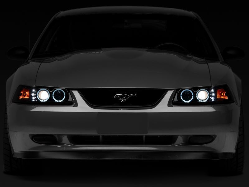 Raxiom 99 - 04 Ford Mustang Dual LED Halo Projector Headlights - Black Housing | Smoked Lens - JDMuscleShop the look 2rax49113