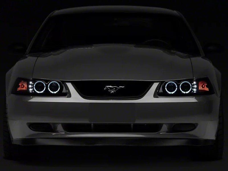 Raxiom 99 - 04 Ford Mustang Dual LED Halo Projector Headlights - Black Housing | Smoked Lens - JDMuscleShop the look 2rax49113