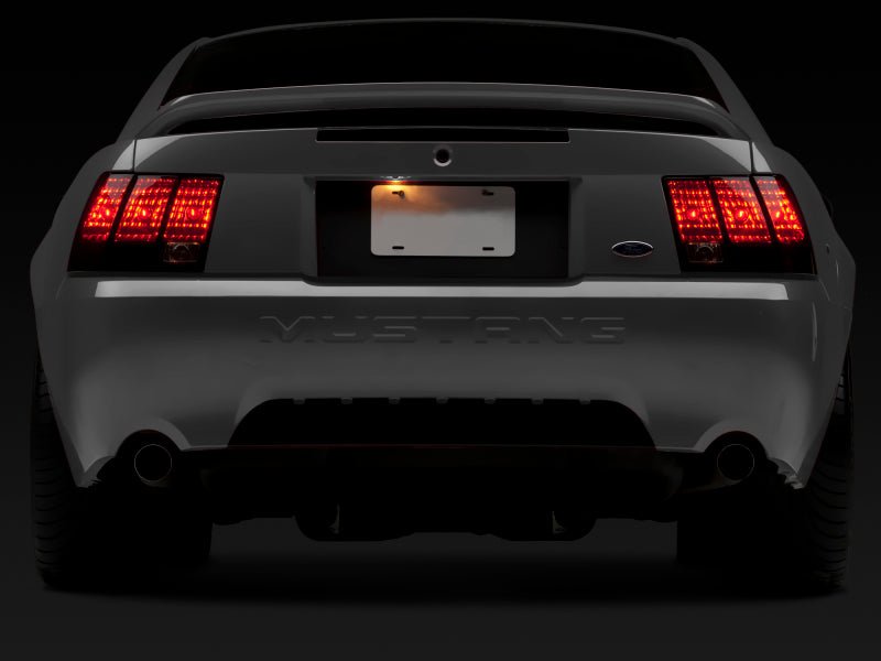 Raxiom 99 - 04 Ford Mustang Smoked Tail Lights with Black Housing | rax49080 - JDMuscleSPK547980