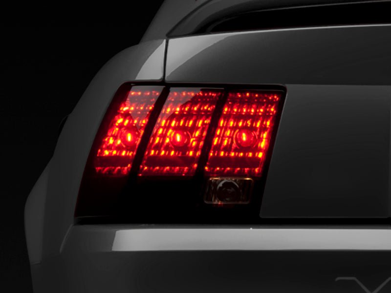 Raxiom 99 - 04 Ford Mustang Smoked Tail Lights with Black Housing | rax49080 - JDMuscleSPK547980