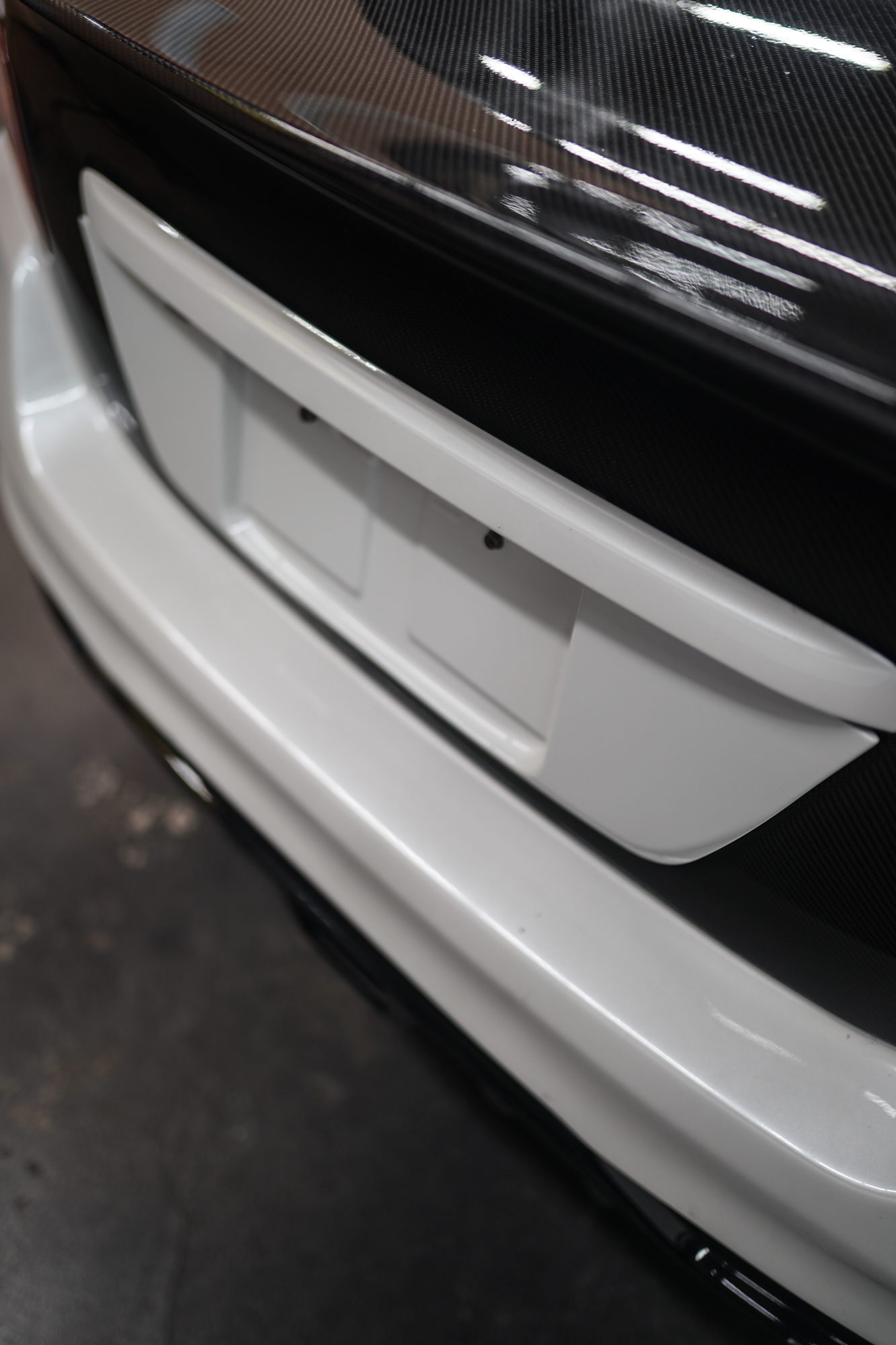 JDMuscle Gloss Black / Paint Matched License Plate Backing - 15-21 Subaru WRX/STI